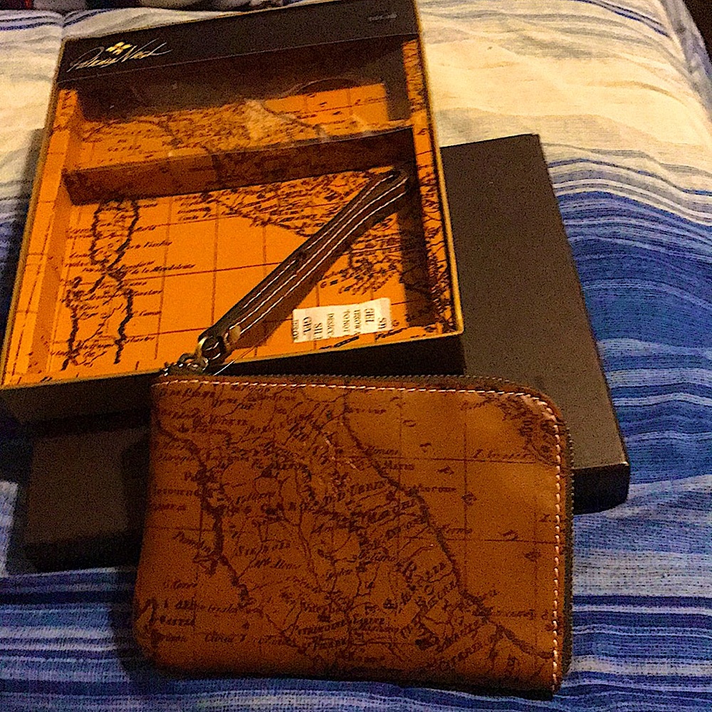 Brown handbag with a country as print.